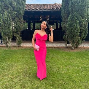Pink strapless bodycon dress with feathers on top!